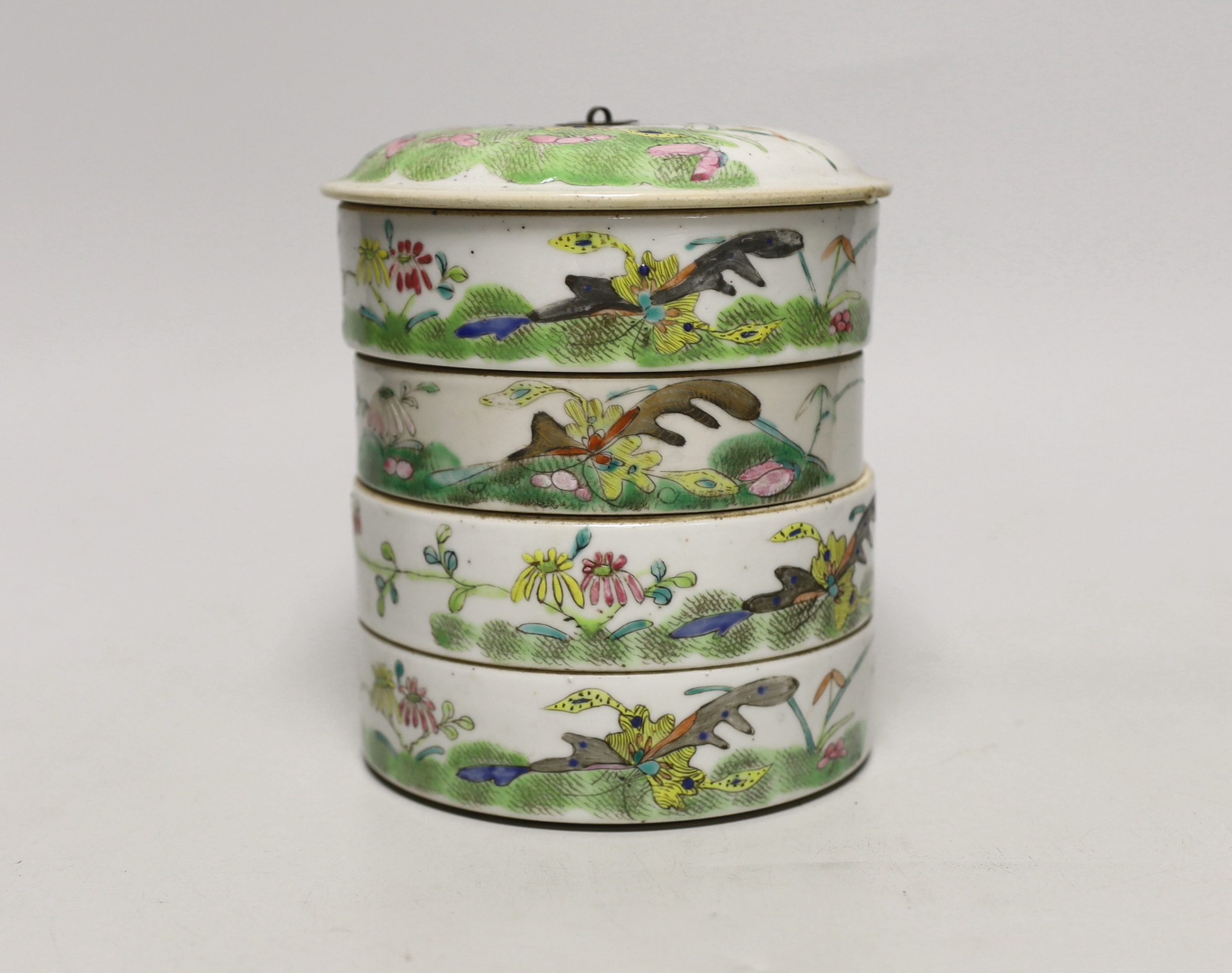 An early 20th century Chinese enamelled porcelain four section stacking food container and cover 14cm high